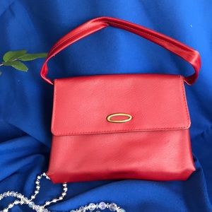 Child’s red vinyl purse